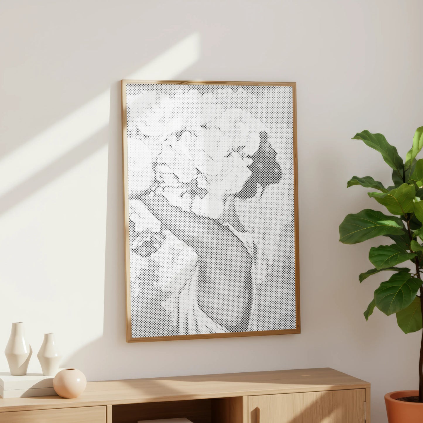 Framed artwork of a woman with flowers on a wall in a room with a plant and wooden cabinet. Woman with Flower Crown | Dot Painting Kit