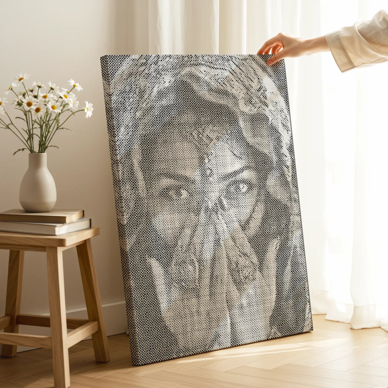Person holding a large woven art piece of a face in a room with a stool and vase. People and Portraits dot painting kit collection 