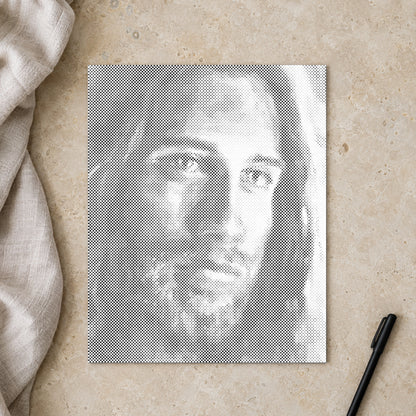Punktmalerei-Leinwand “Jesus Christus”, von oben auf einem Arbeitstisch bei sanftem Tageslicht.
