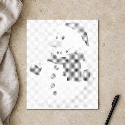 Punktmalerei-Leinwand “Schneemann”, von oben auf einem Arbeitstisch bei sanftem Tageslicht.